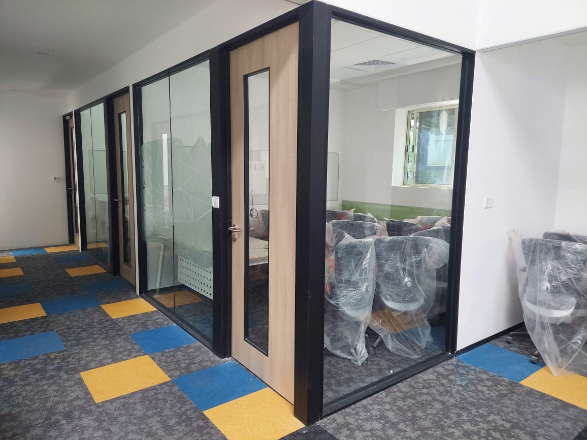 Glass partition with wooden door office interior
